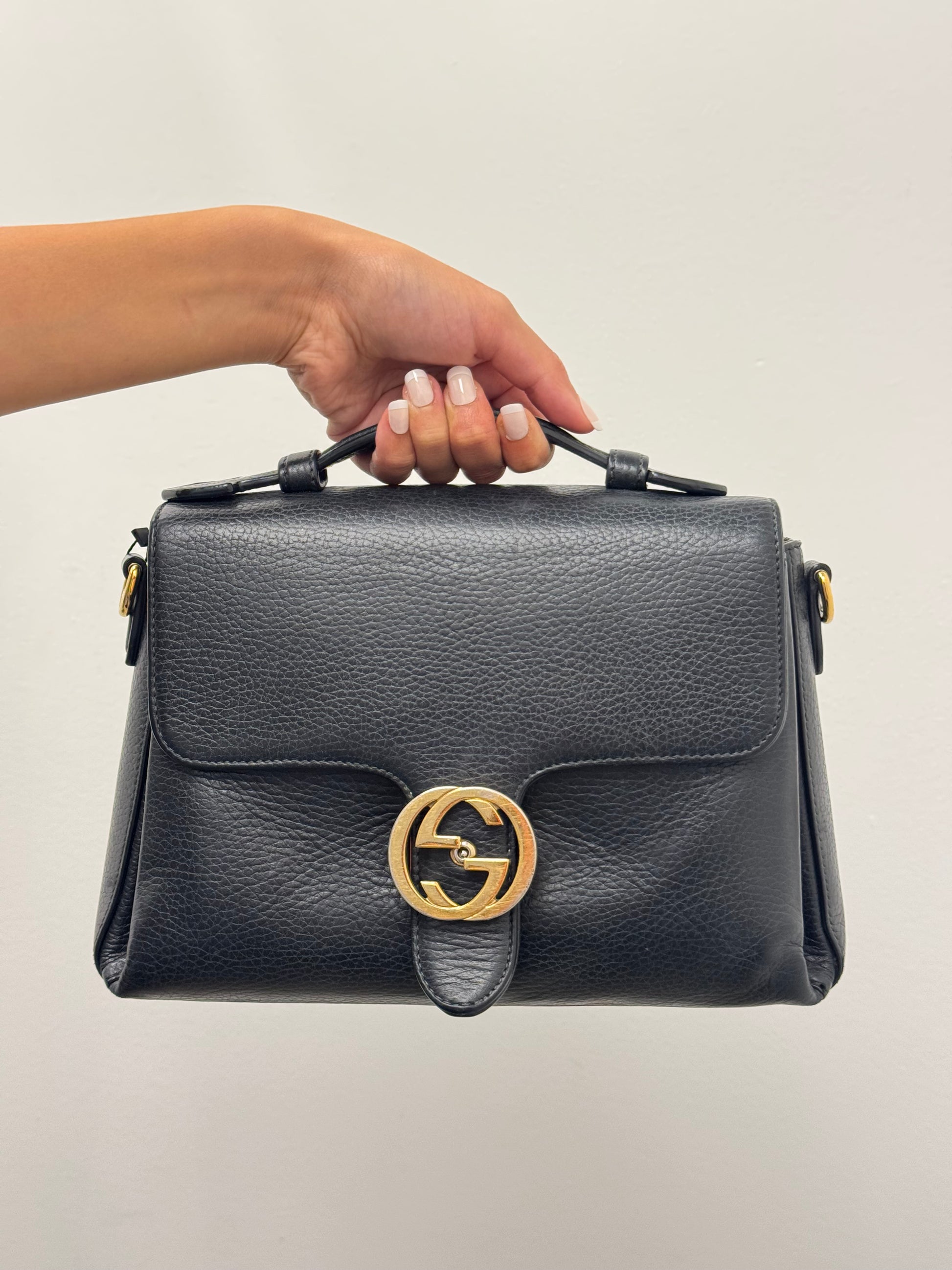 Gucci Interlocking G top handle bag.