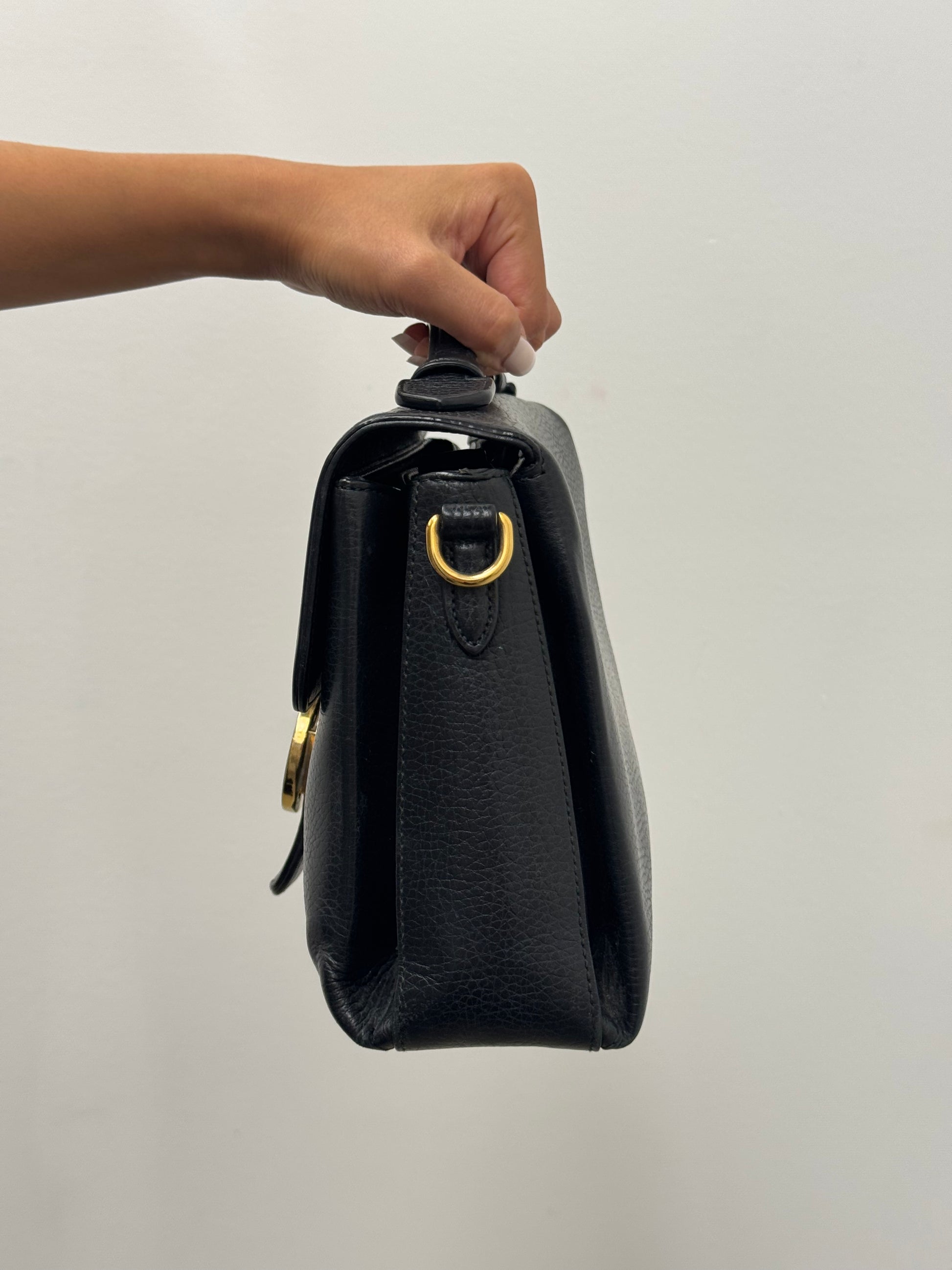 Gucci Interlocking G top handle bag.