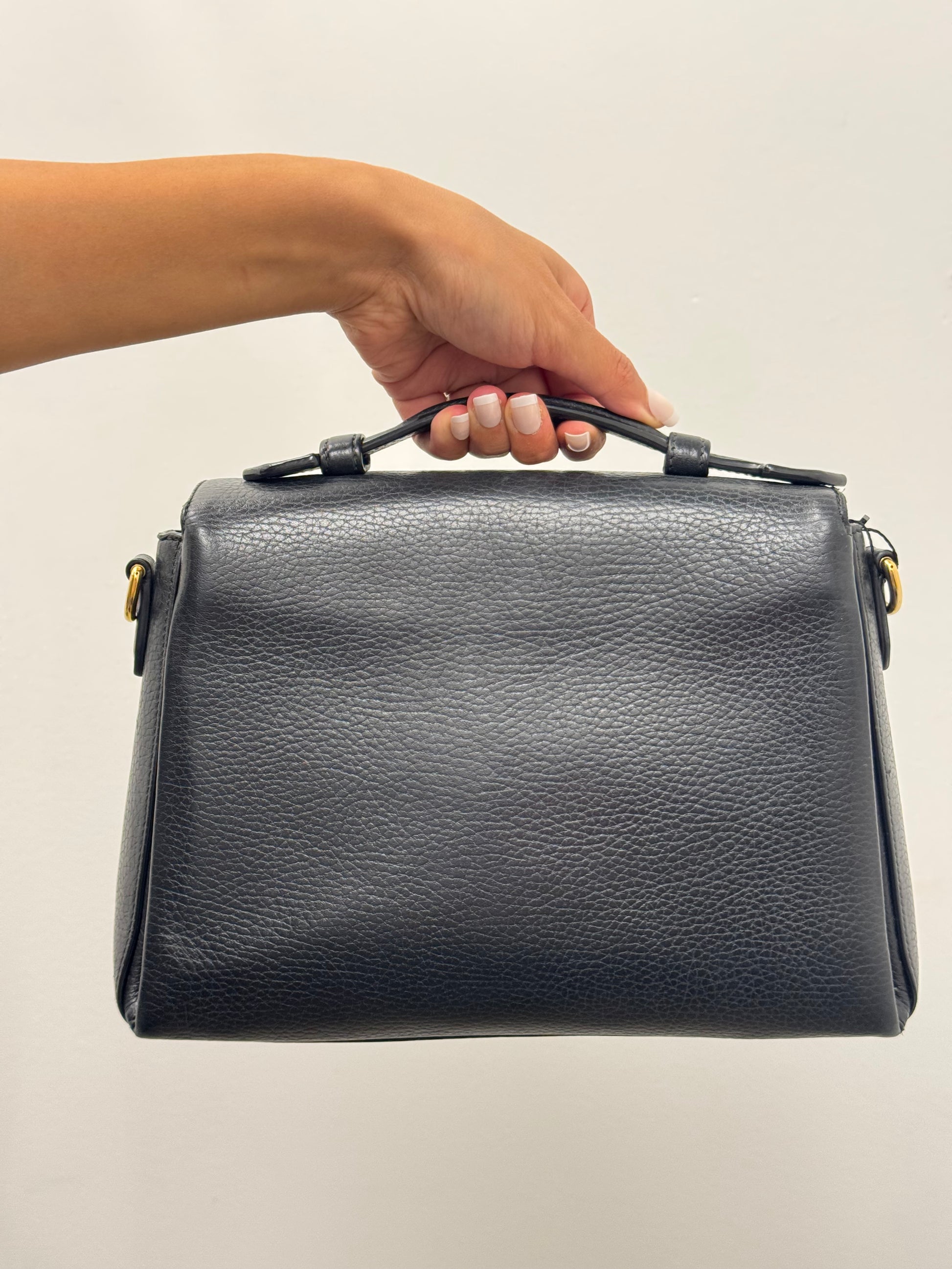Gucci Interlocking G top handle bag.