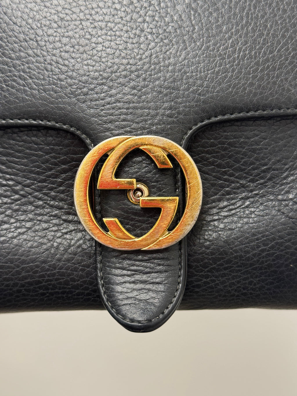 Gucci Interlocking G top handle bag.
