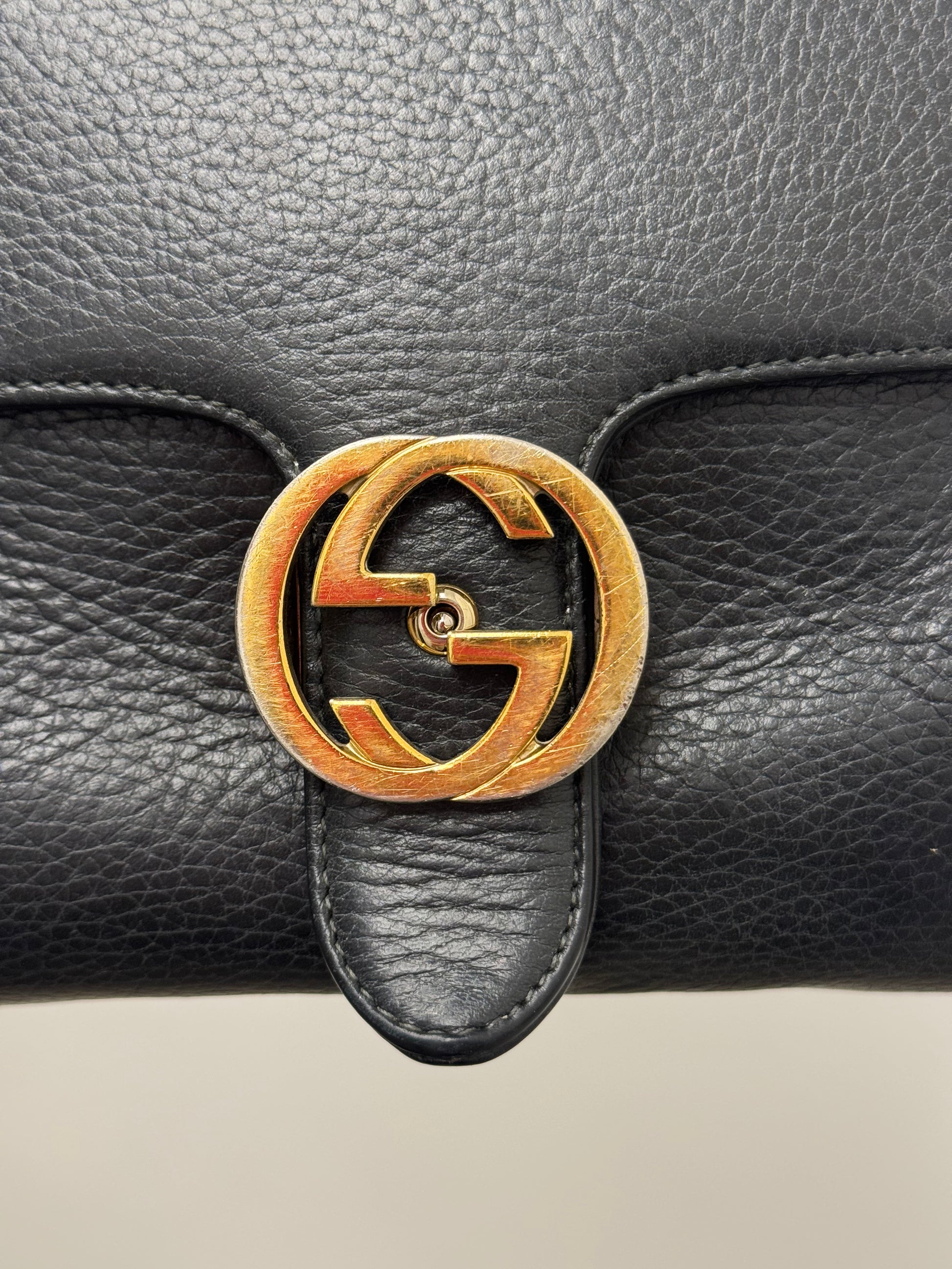 Gucci Interlocking G top handle bag.