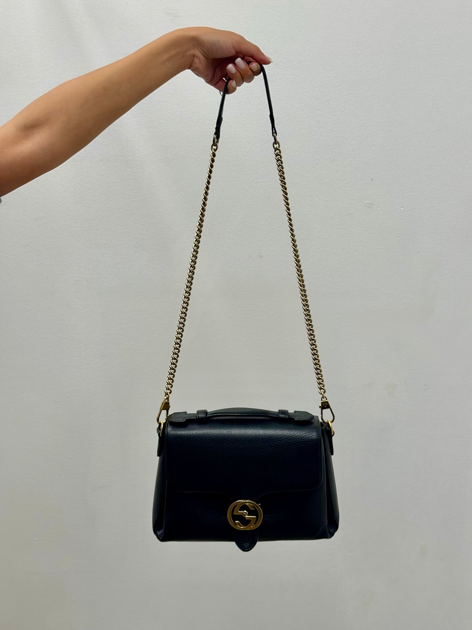 Gucci Interlocking G top handle bag.