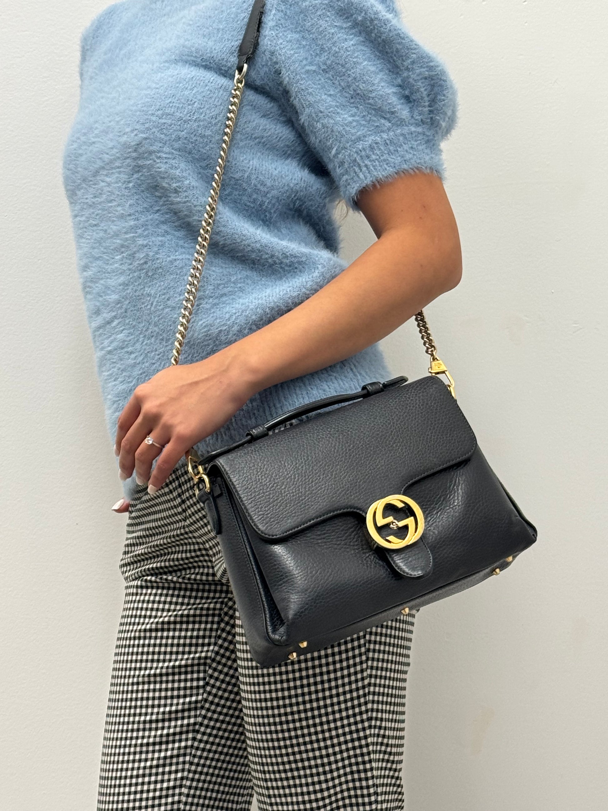 Gucci Interlocking G top handle bag.