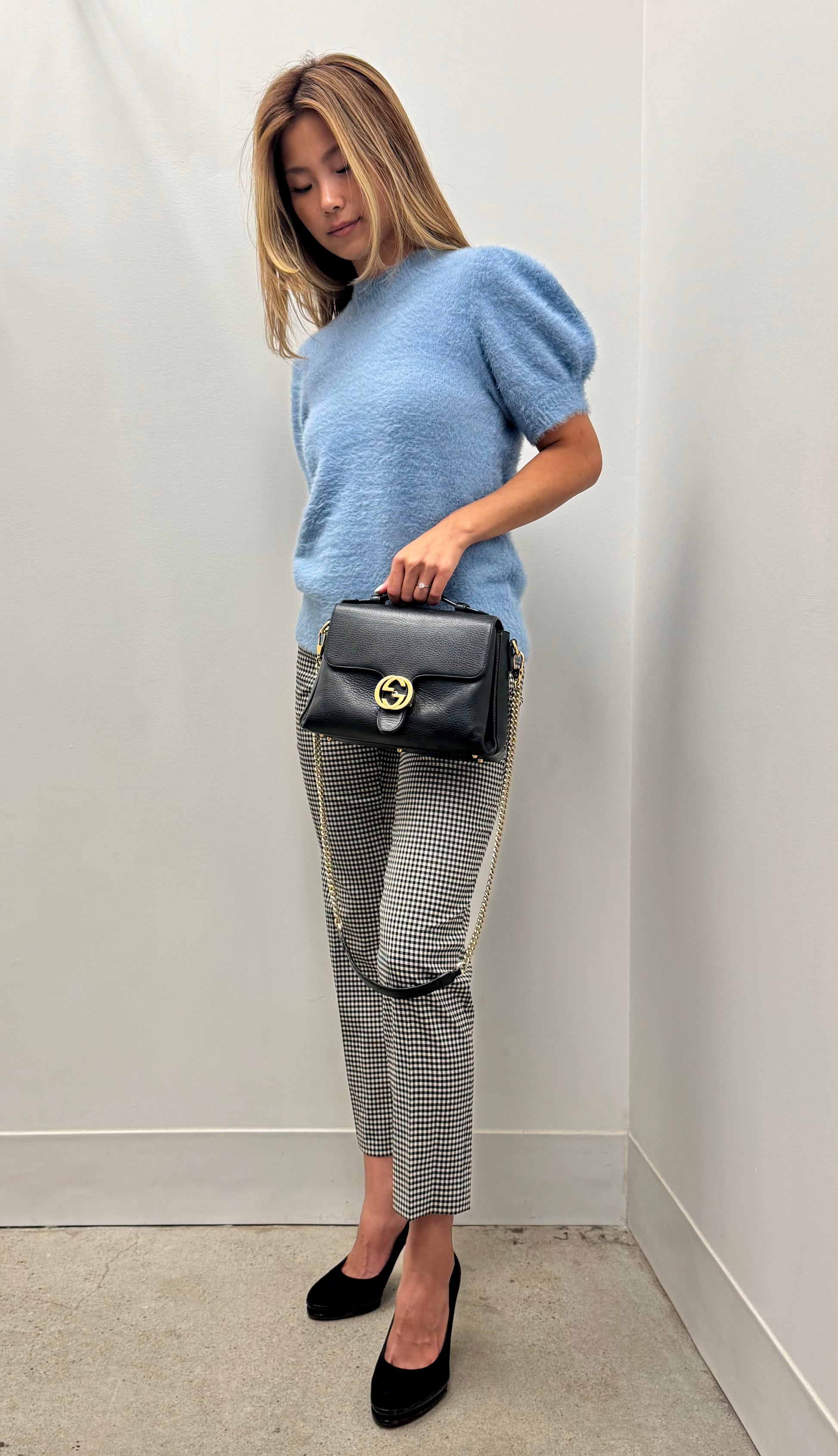 Gucci Interlocking G top handle bag.