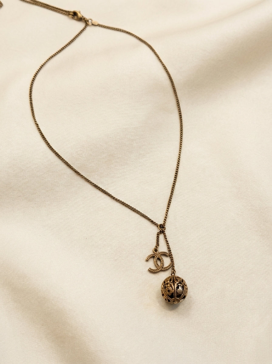 Chanel 06P Gold Tone Filigree Ball & CC Charm Necklace